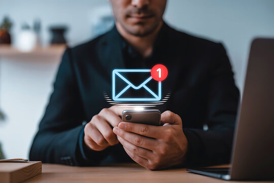 Man checking new email notification on smartphone with glowing envelope icon