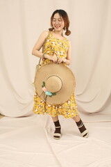 Studio lookbook with vintage dresses, soft lighting, and feminine styling on a plain backdrop.