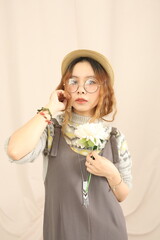 Studio lookbook with vintage dresses, soft lighting, and feminine styling on a plain backdrop.