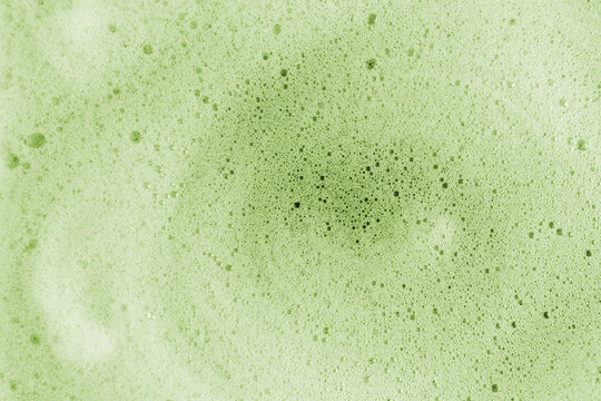 Macro view of vibrant green matcha foam texture