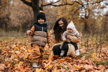 Family autumn outing with children in a park