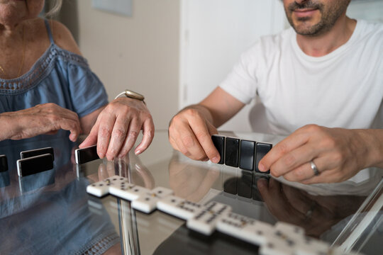 Multigenerational family enjoying a game of dominoes