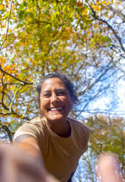 Woman hiking through Gorbea Natural Park in autumn