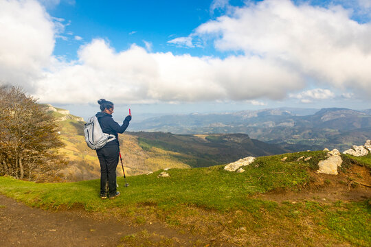 Woman hiking in Gorbea Natural Park during autumn