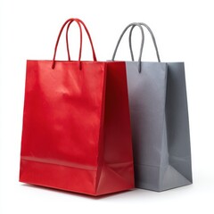 Two colorful paper shopping bags one red and one grey isolated on white background