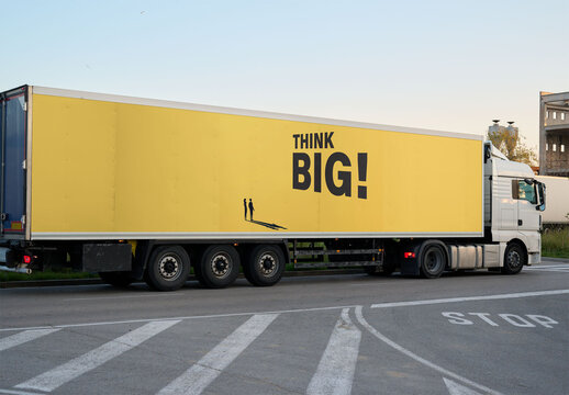 A large delivery truck mockup is parked on a street corner, showcasing empty space for branding