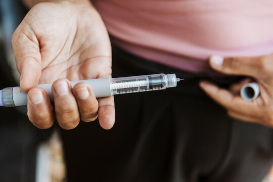 Woman medicates outside van in autumn New Zealand