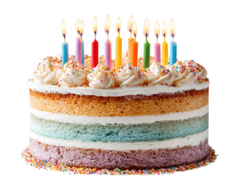 Colorful layered cake with lit candles