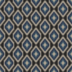 seamless pattern featuring a Navajo or Aztec-inspired geometric design, characterized by repeating diamond shapes in shades of blue, beige, and dark brown.
