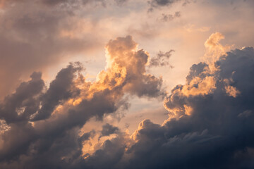 Dramatic sunset clouds with golden highlights