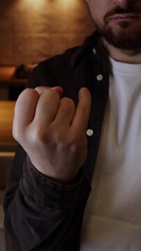 Man showing pinky finger insulting other man meaning he is weak or have a small penis