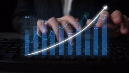 A focused view of hands typing on a keyboard with an overlay of a rising graph trend, showcasing...