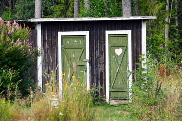 old wooden door with heart on toilett, jämtland,åre, norrland,hensjön,sverige,sweden,summer
