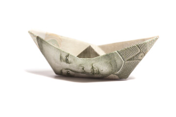 Money origami boat with one yuan chinese currency isolated on white