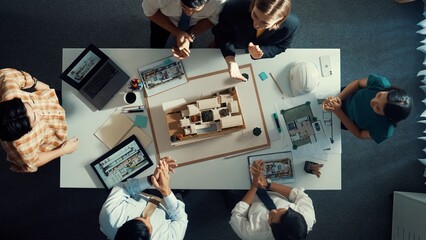 Top view of smart manager clapping hands and putting hands together to celebrate project. Aerial...