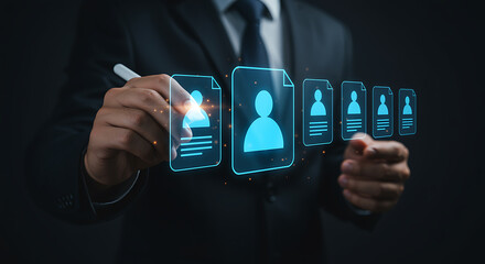 Businessman interacting with digital profiles on a dark background human resources technology