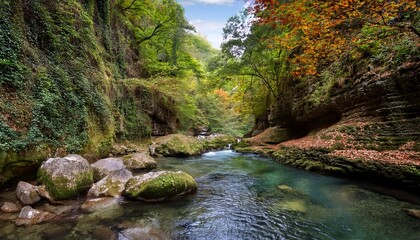 immerse yourself in a captivating gorge where a clear river flows through vibrant foliage the natural scenery creates a peaceful escape and invites exploration