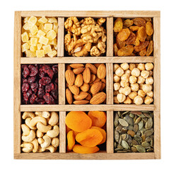 Wooden compartments containing various nuts, seeds, and dried fruits on transparent background
