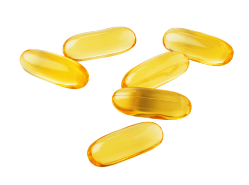 Fish oil capsules falling on transparent background