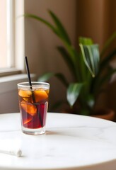 Refreshing cuba libre cocktail drink with cola lime and rum on white table top indoors
