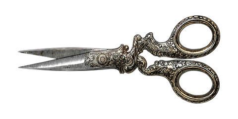 Ornate antique scissors with detailed engraving and golden hue engraved metal