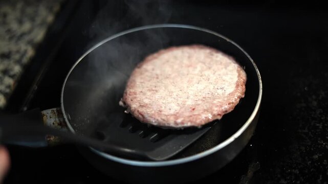 Frying A Frozen Hambuger Patty In Pan