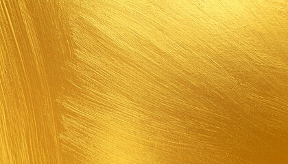 刷毛のペンキの塗り跡が残るグラデーションのある金色の壁の画像