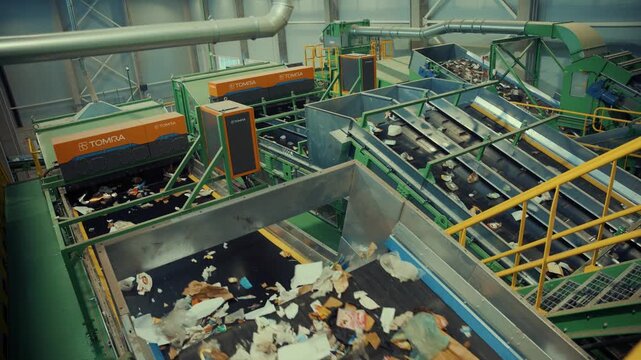 A modern automated waste sorting line inside an industrial facility