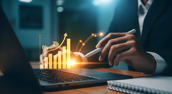 Business person analyzing financial graphs on laptop - Powered by Adobe