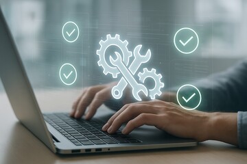 Hands typing on laptop with futuristic hologram of system configuration tools and gear icons representing technical support and software maintenance workflow