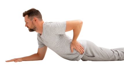Man experiencing back pain while lying on stomach, isolated on white background.