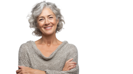 Smiling senior woman with gray hair, wearing a cozy sweater and exuding warmth and confidence.
