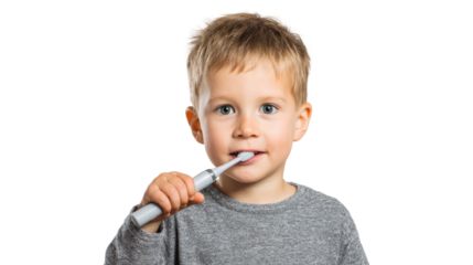 Young child brushing teeth with a toothbrush, smiling at the camera, white isolated background.