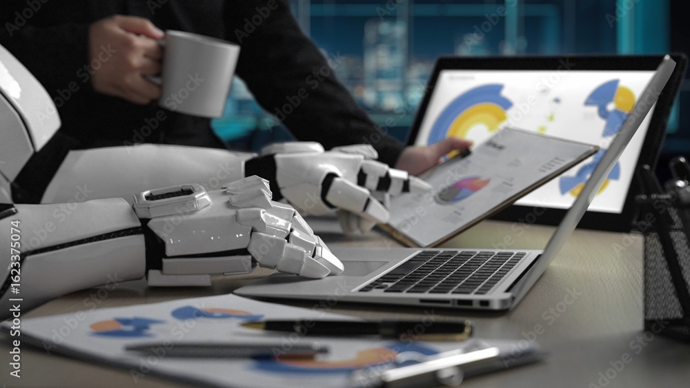 Poster a modern office scene showcasing robotic hands analyzing data charts on a laptop, illustrating the f