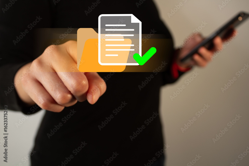 Aufkleber businesswoman holding a cell phone while pointing at a floating icon of a folder with a document and