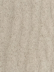Evenly laid sand on the Baltic Sea beach in Mrzeżyno serves as a background