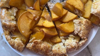 Slice of homemade peach pie on a plate — summer dessert for culinary recipes, blogs, and dessert packaging