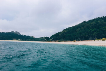 turquoise waters crystal clear green view of the beach wild cies islands paradise natural biosphere many rocks and clouds