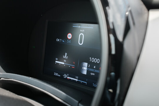 Digital dashboard displaying speed temperature and RPM information A modern and sleek vehicle cockpit with a state of the art display