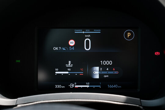 The digital dashboard of a car displays the speed temperature fuel level and RPM with 16640 km on the odometer
