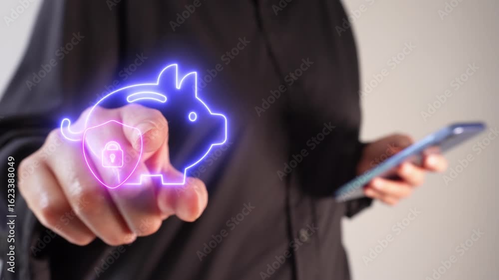 Poster Business person holding a cell phone while pointing at a luminous floating icon of a piggy bank with a shield and a padlock