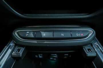 Car console with gear shift selector showcasing 'P' for park 'R' for reverse 'N' for neutral and...
