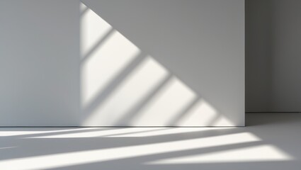 Shadows cast by window blinds on a white wall and floor interior space. Minimalist and modern design. Light and shadow play. Concept of natural illumination and interior architecture.