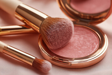 Artistic close up of makeup brushes and blush compact, showcasing elegant rose gold design and soft bristles, perfect for beauty enthusiasts