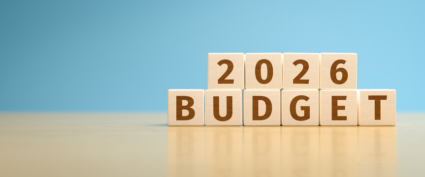 Wooden toy cubes forming the text "2026 BUDGET". Concept for planning the yearly budget for 2026.