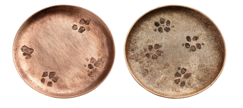 Two circular, shallow, wooden-like plates with a repeating flower-like pattern