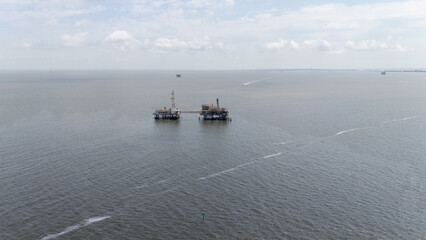 Offshore Oil Rigs in Vast Ocean