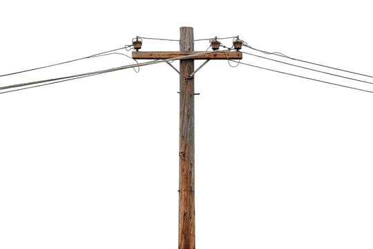 Close-up of weathered wooden utility pole with electrical wires