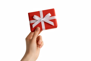 Human hand holding a red gift box with a white ribbon, symbolizing gifts, celebrations, and thoughtful gestures.