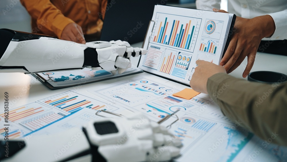 Poster human and robotic hands engage in a collaborative analysis of business data, showcasing graphs and c